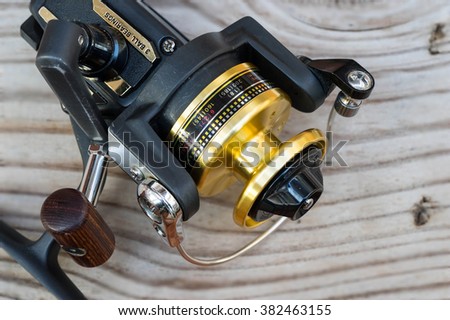 fishing gear on wood background