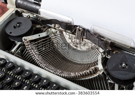 Old vintage antique typewriter machine with paper for text. Writer creation concept.