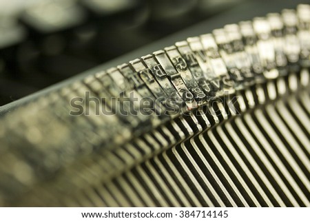 Close up of hammer keys on an old type writer. Shallow depth of field.