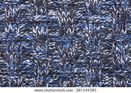 Blue white black knitted fabric made of heathered yarn textured background
