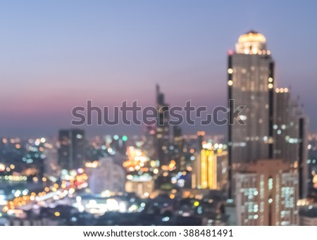 Blur city background rooftop view of cityscape business building landscape night lights bokeh