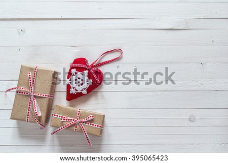 Background with gift boxes and hearts on painted wooden planks. Place for text. Top view with copy space