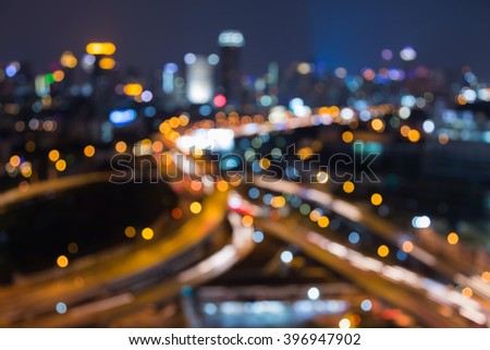 Blurred bokeh lights city highway interchanged night view