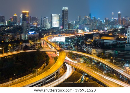 Aerial view interchanged road with city downtown background night view