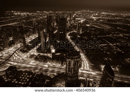 Dubai downtown night scene with city lights. Top view from above