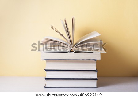 Open book, hardback books on wooden table.Education background. Back to school. Copy space for text.