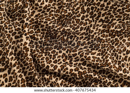 Fabric knitted with a pattern leopard. Texture, background