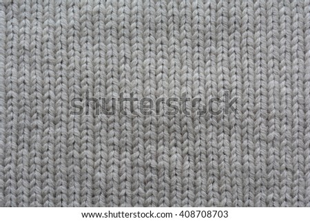 Grey wool knitting.  Textile background. Old handmade knit
