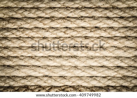 Rope with knots on the background of wooden boards