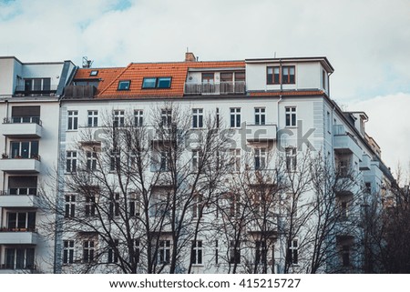 white facade building with orange rooftop at berlin