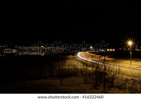 heavy car traffic on road at night time