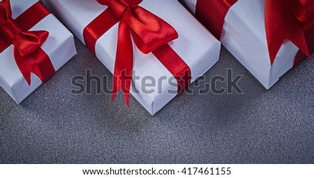 Set of present boxes on grey surface holidays concept.