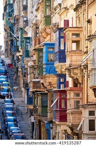 A view of the typical Street of Valletta  (St. Paul's street) with traditional varicoloured maltese balconies.