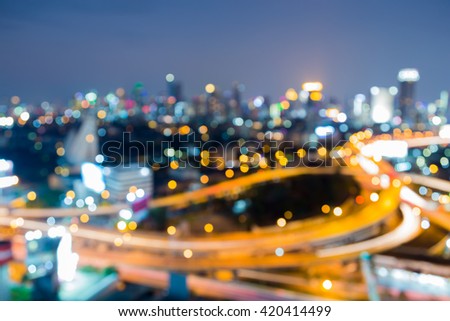 Aerial view, abstract blurred bokeh lights, Highway interchanged and city downtown background
