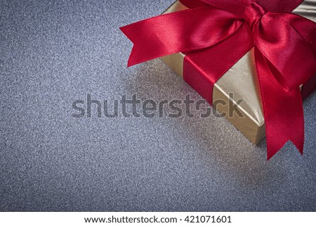 Packed present box on grey background holidays concept.