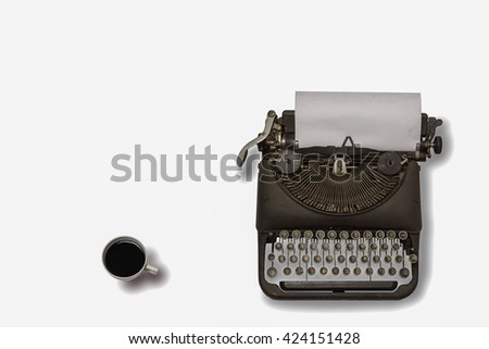 Vintage typewriter and coffee on white background