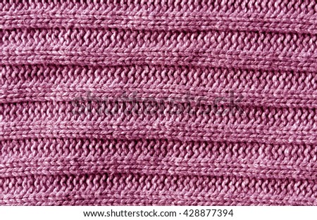 Abstract pink knitting cloth texture. Background and texture for design.
