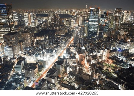 Cityscape view with skyscrapers and city lights at night, Tokyo, Japan