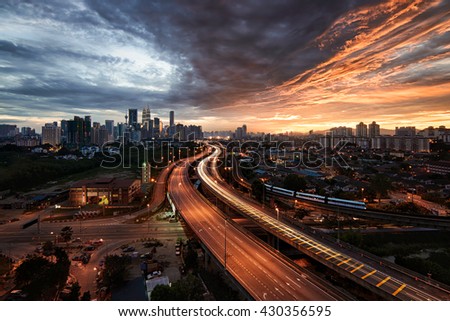Kuala Lumpur Skyline with light trail and beautiful sunset