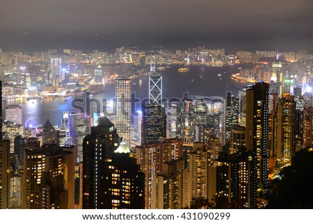 Hong Kong Skyline and Victoria Harbour at night from Victoria Peak on Hong Kong Island, Hong Kong, China.