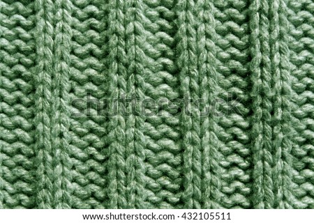 Abstract green knitting texture close-up. Background and texture for design.