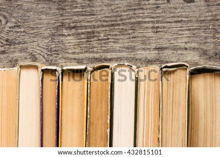 Books On The Wooden Background.