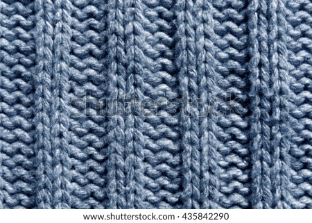 Abstract blue knitting texture close-up. Background and texture for design.