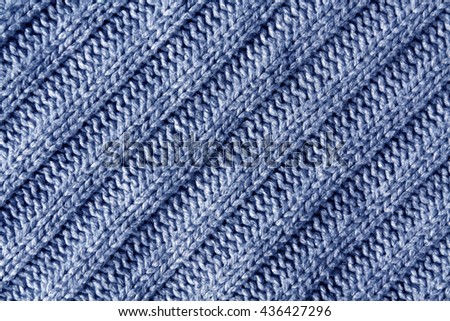 Abstract blue knitted cloth texture. Background and texture for design.