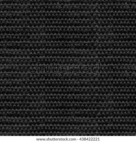 The texture of black, tight braid fabric