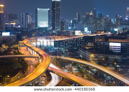 Bangkok skylines and highway traffic motion in the sunset. The View from the top, Thailand. City scape and civilization concept.