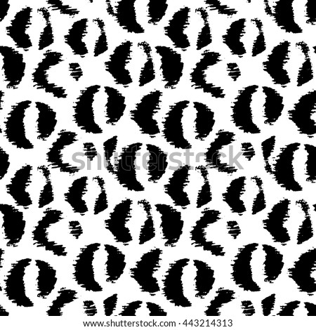 Hand drawn jaguar pattern. Black animalistic spots on white background. Seamless vector illustration.