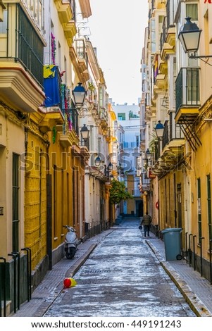 view of a narrow street in spanish city cadiz