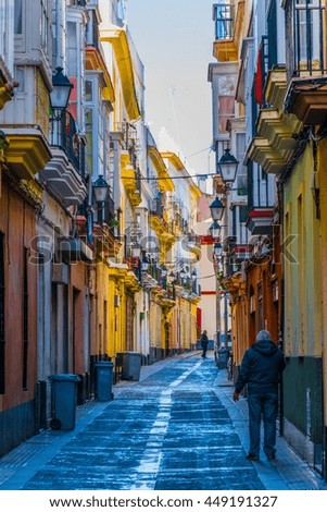 view of a narrow street in spanish city cadiz
