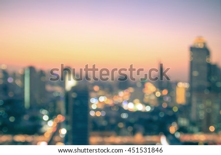 Sustainable city life background concept: Balcony view of blur urban night