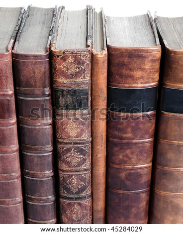 Row of old leather bound books isolated against a white background