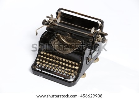 Old fashioned, vintage typewriter isolated on white background with a blank sheet of paper inserted with space for a custom message