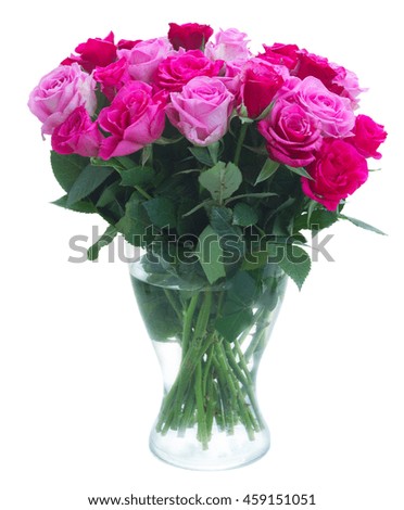 bouquet of pink and magenta fresh rose flowers in vase isolated on white background