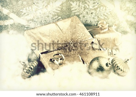 Golden christmas gift in snow
