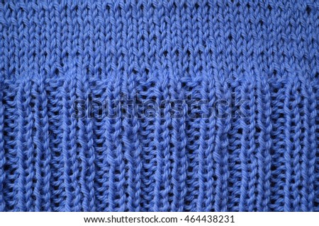 Background with knitting patterns on clothing blue