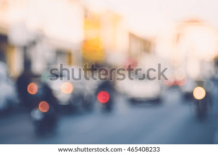 Blur traffic road with colorful bokeh light abstract background. Copy space of transportation and travel concept. Retro tone filter color style.