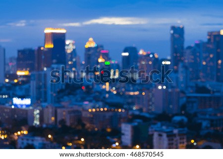 Blurred lights big city downtown at twilight, abstract background