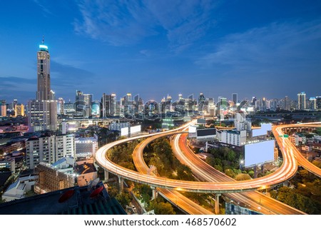 Long exposure, Aerial view highway interchanged with city downtown background 