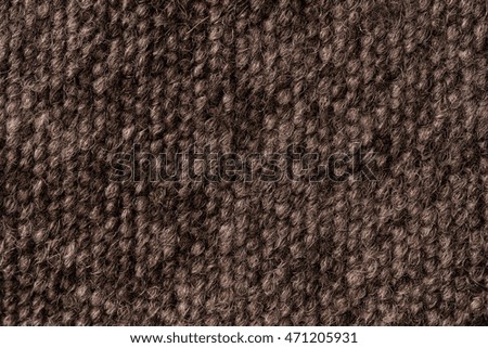 Brown cotton and wool fabric texture background with detailed threads in closeup 