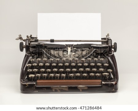 Old Vintage Typewriter and a blank sheet of paper inserted