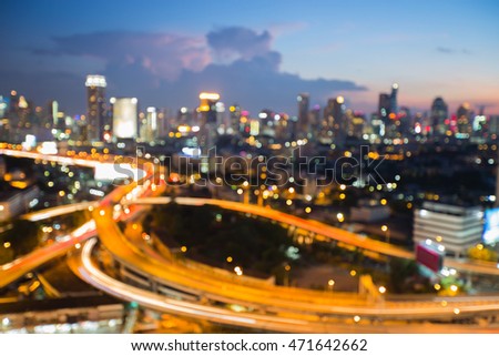 Abstract background, blurred lights city and highway intersection at twilight