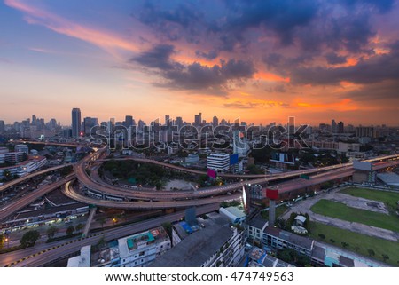 Aerial view cityscape and highway with sunset sky background