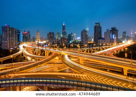 Shanghai elevated road junction and interchange overpass at night in Shanghai, China