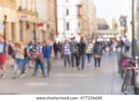 Blurred street in the historical center of Krakow. Defocused background of city life. Urban scene, crowd. Cracow. Poland.