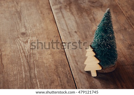 Decorative Christmas tree on wooden table. Selective focus