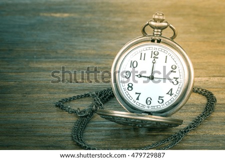 Antique clock vintage on wood background